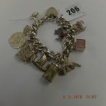 An early hm silver charm bracelet with 10 assorted very fine charms
