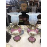 A pair of Victorian pink lustre oil lamps