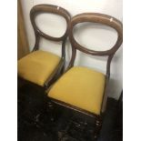 A set of four 19th century balloon back chairs