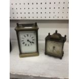 A carriage clock and one other