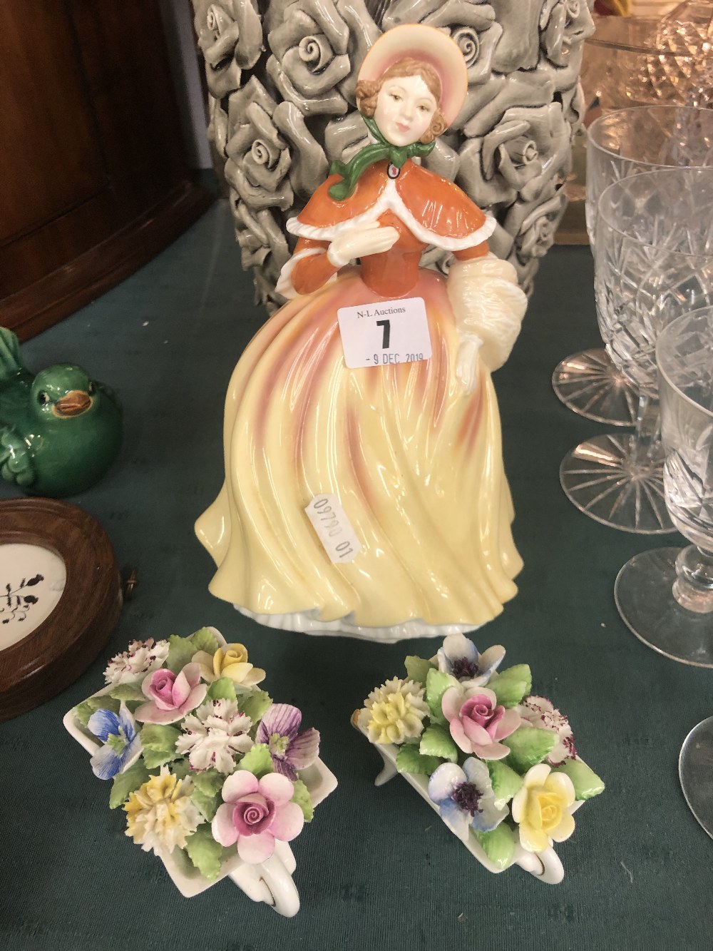 A Royal Doulton figurine and two Doulton posies