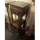 An oriental hardwood plant stand