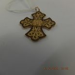 A gold and enamel cross pendant weight 7 grams marked 18k