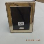 A hallmarked silver photo frame