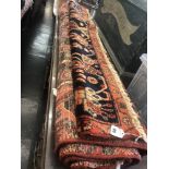 A red ground Persian rug, good condition,