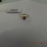 A 9ct pink sapphire and diamond heart ring size P