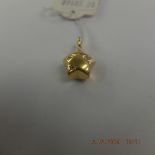 An 18ct yellow gold diamond set star pendant weight 5 grams