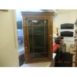 A walnut corner cabinet