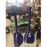 A pair of tall blue art glass vases