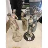 Three Lladro figures and two others