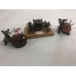 A hm silver decorative miniature carriage and two silver plated 'Teddy' pin cushions