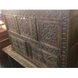 A 19th century carved oak mule chest.