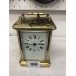 A brass cased Finnigans carriage clock