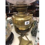 A Victorian brass oil lamp Cranberry shade