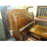 A mahogany sleigh bed