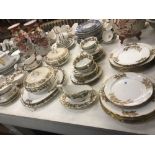 A substantial Royal Staffordshire Scottish Thistle dinner set