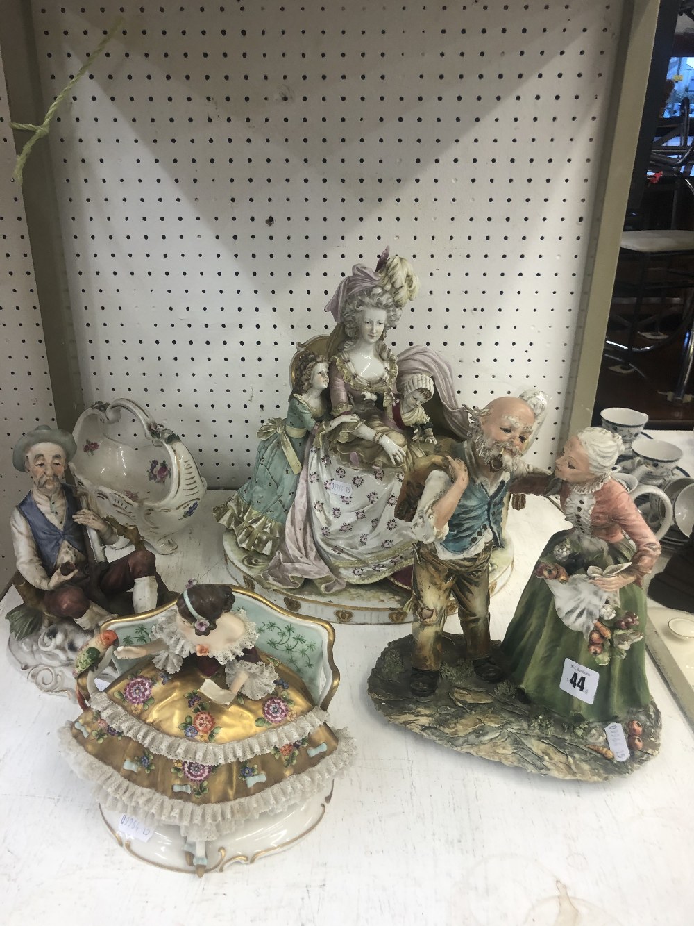 Four continental porcelain figures a/f and a bowl