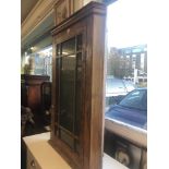 A walnut corner cabinet