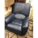 A blue leather reclining arm chair