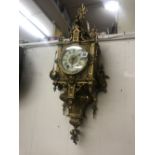 A French gilt brass wall clock circa 1900