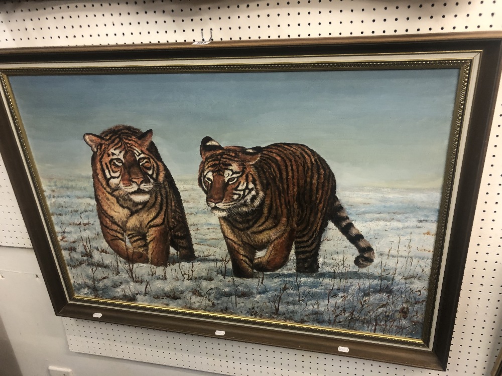 An oil on canvas of snow tigers signed (1983) 101cm W x 71cm H