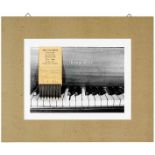 Beuys, Joseph. Am Klavier George Jappe. Photographie, auf graue Pappe aufgezogen, mit montiertem
