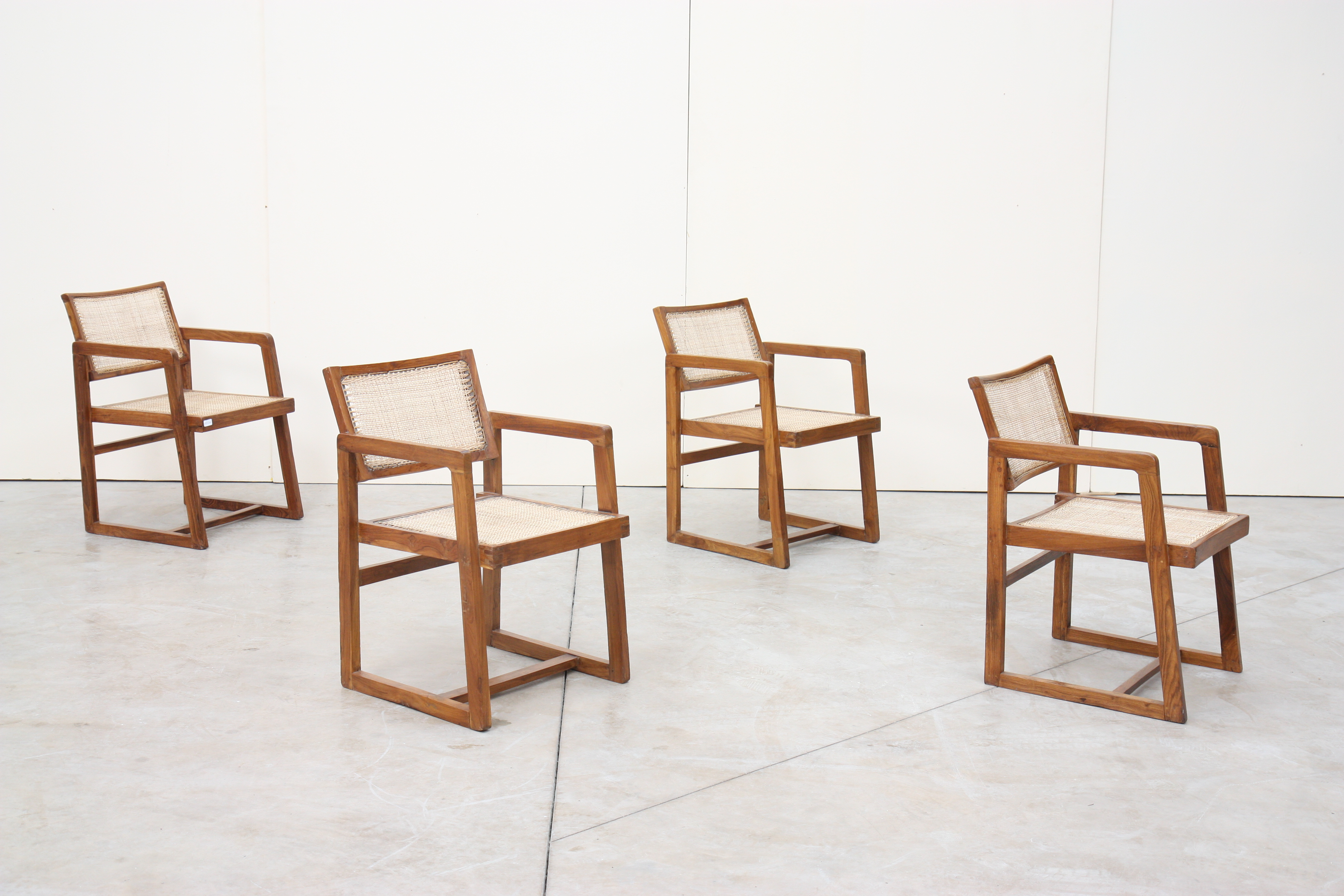 PIERRE JEANNERET (1896-1967) Ensemble de quatre fauteuils dit : "Cane seat back [...]