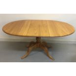 ERCOL CHESTER TABLE. An extendable Ercol 'Chester' table design #1117 with cover.