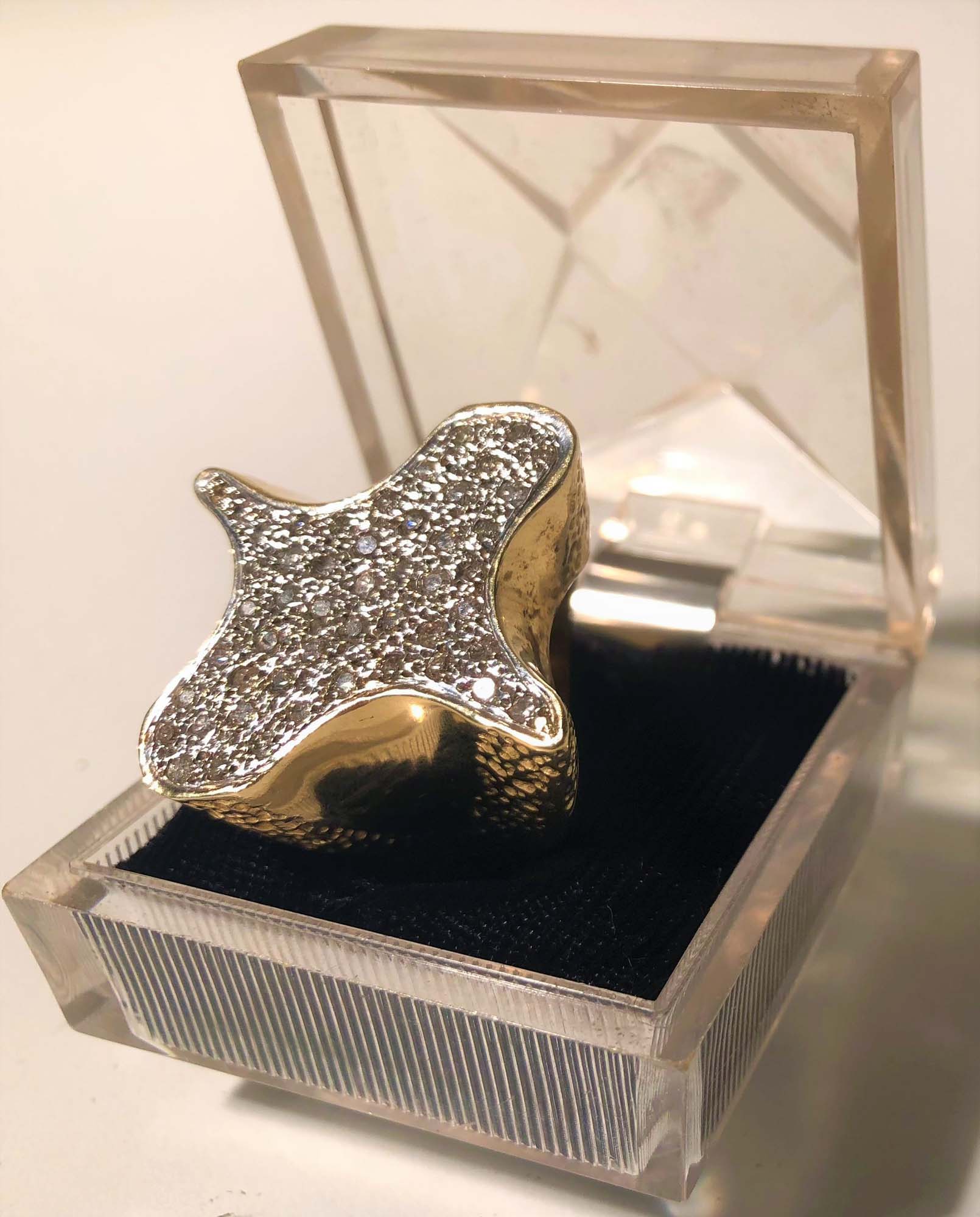 ELVIS PRESLEY PERSONALLY OWNED AND WORN DIAMOND & GOLD "CLOVER" RING.