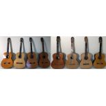 EIGHT ACOUSTIC GUITARS.