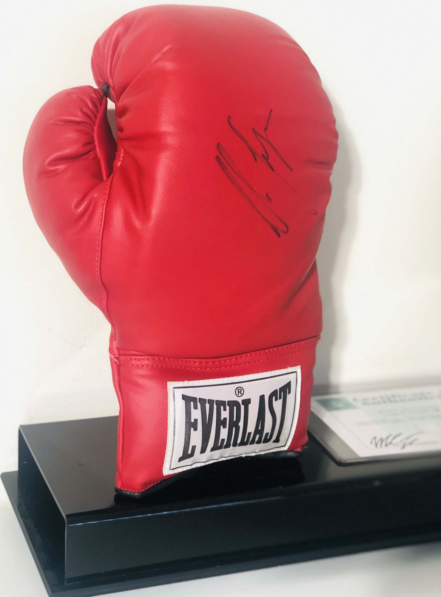 MIKE TYSON. An Everlast boxing glove signed in black ink by Mike Tyson.