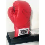 MIKE TYSON. An Everlast boxing glove signed in black ink by Mike Tyson.