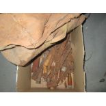 Box of assorted tools and World War II parachute bag