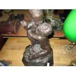 Bronzed metal figure of children at play