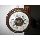 Early 20th century aneroid wall barometer with carved oak rope twist case