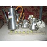 Polished pewter four part tea set by Selangor & Italian pottery lion ornament