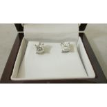 Pair of elegant modern square modified cut diamond earrings, each earring is 1 ct,