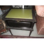 Vintage ebonized carved wooden coin collectors cabinet on tapering legs opening to reveal drawers