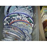 Assorted blue and white plates and chargers