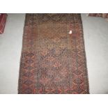 Antique rug : Belouche red ground with geometric decoration 150 cms x 87 cms