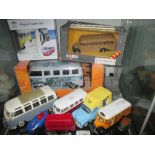 Shelf of die cast toy cars : VW camper van,