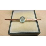 Unmarked but tested 9 ct gold bar brooch set with topaz coloured stone 1.