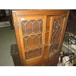 Vintage oak glazed linenfold bookcase