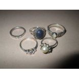 5 x Modern silver rings set with five hard stones