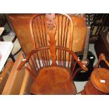 18th / early 19th century yew and elm wheel back Windsor chair with swept back arms