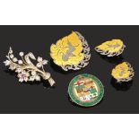 A Dominion of Canada enameled silver coin brooch, an Siam enameled silver suite of jewellery and a