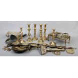 A large quantity of brasswares to include candlesticks, trivets, horse brasses, equestrian