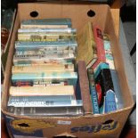 A box of mainly hardback books on aviation, war etc.