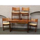 A G plan style teak extending dining table, 181 x 88cm along with four matching dining chairs.