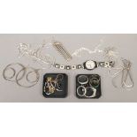 A collection of dress jewellery mainly silver including rings, pendants and chains.